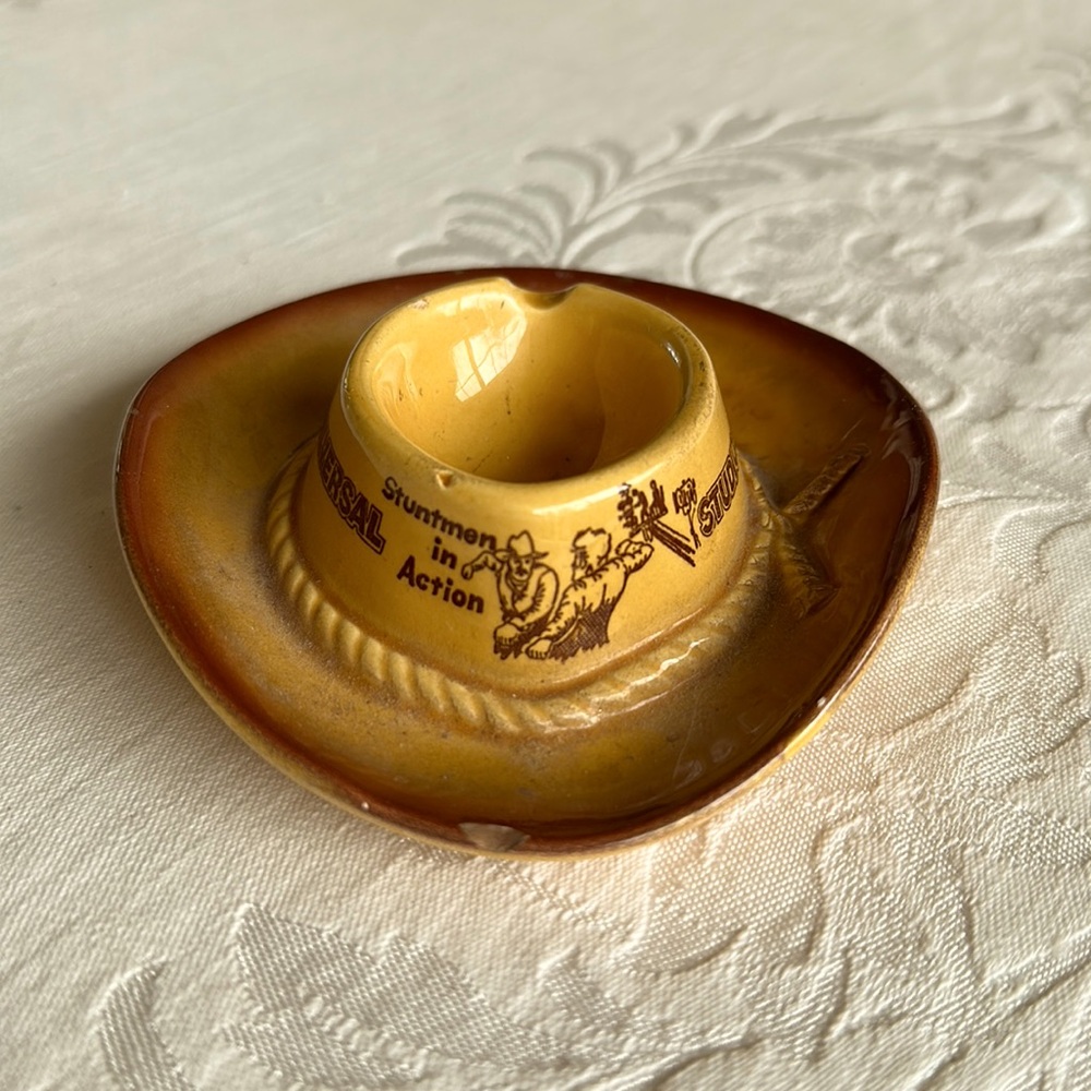 Vintage, ceramic, Universal Studios, stunt men, in action cowboy hat, ashtray.